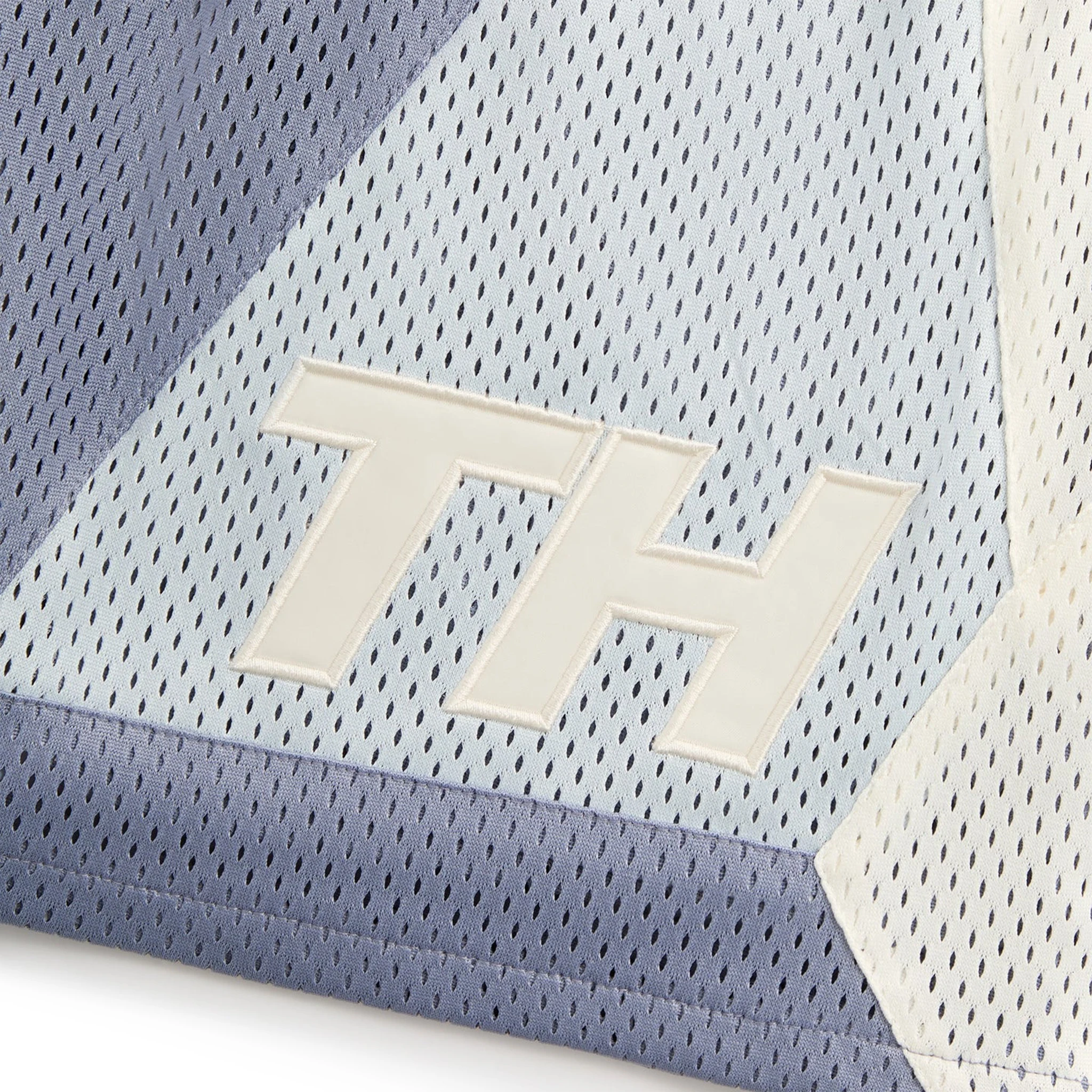 Logo view of Kith Mesh Turbo Shorts Monet